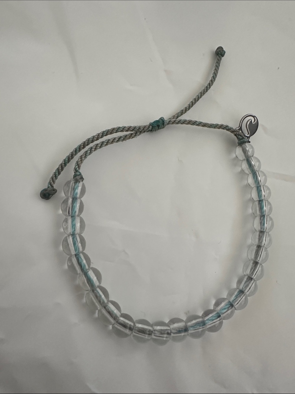 NWOT 4Ocean Adjustable Clear Bead Bracelet with Grey and Blue Cord